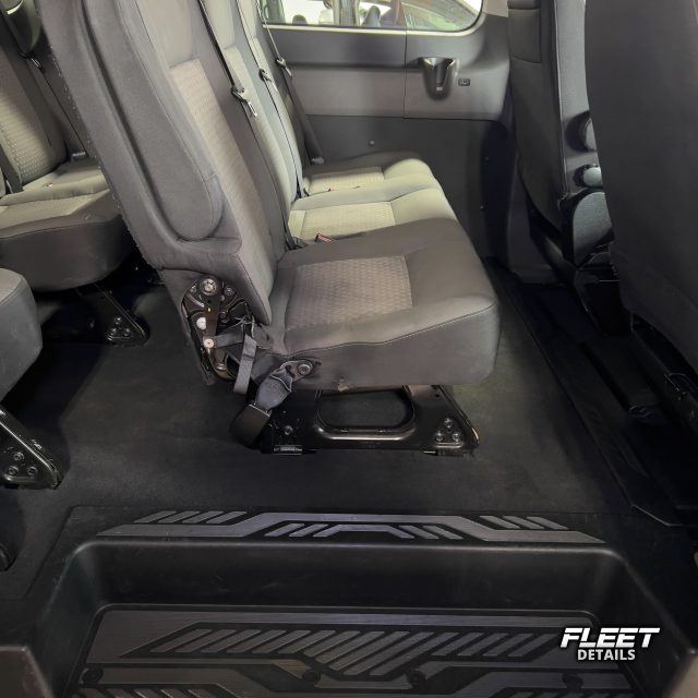 Inside of a vehicle's interior showing the dashboard and seats and carpet cleaned from an interior mobile detail
