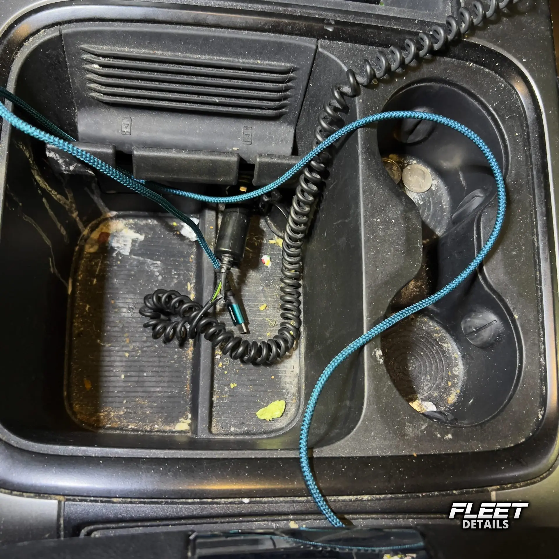 Inside of a vehicle's interior showing the dashboard and seats and carpet cleaned from an interior mobile detail