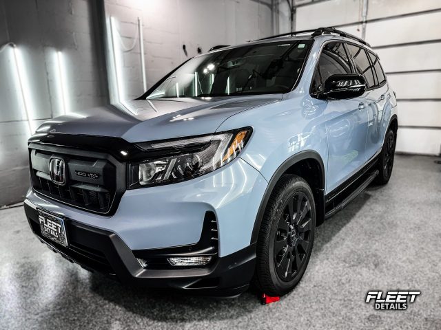 A vehicle receiving a professional ceramic coating by Fleet Details in Rockford, IL. Our ceramic coating services provide unmatched protection against scratches, UV damage, and environmental contaminants, ensuring a long-lasting glossy finish. Contact us for expert ceramic coating near you.