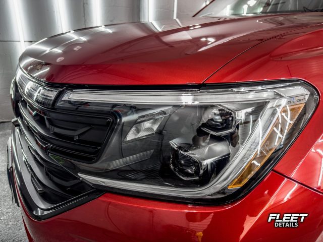 Headlight and grill showing off it's new shine after ceramic coating installation in rockford, il.